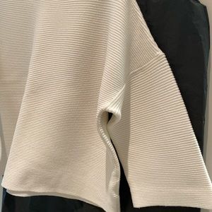 Like new modern cut sweater, worn twice. 3/4 length sleeve.